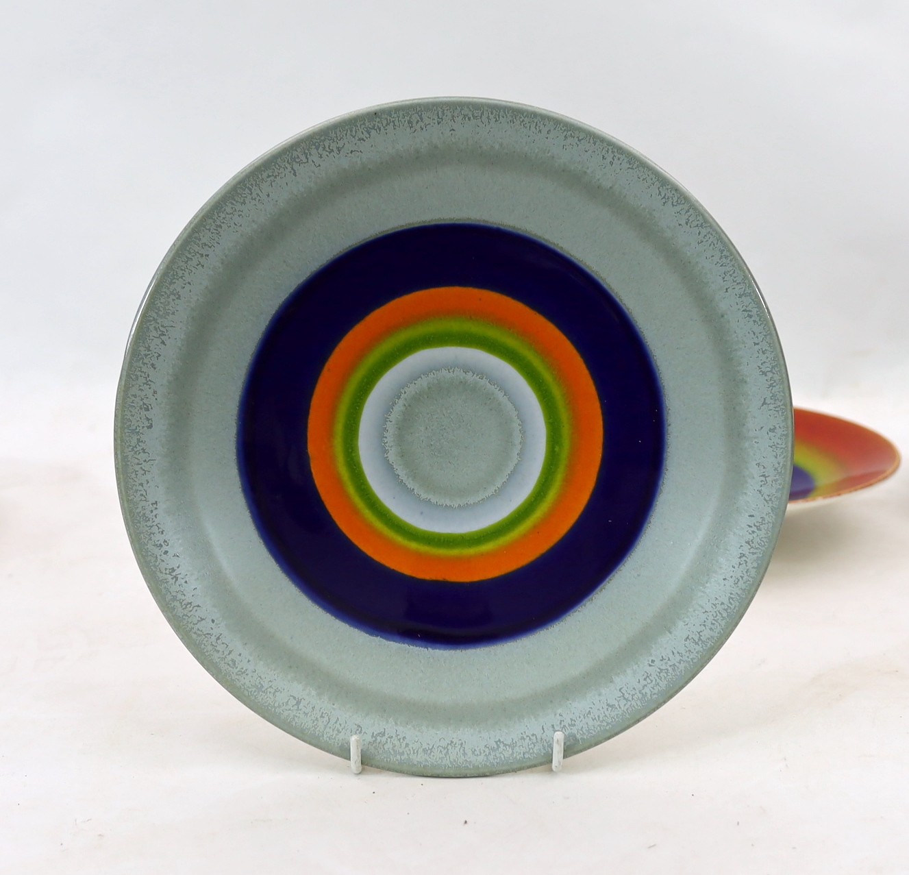 Alan Clarke for Poole Pottery. A set of nine ‘Alignment of the Planets’ chargers and one duplicate, c.2000, 26cm diameter